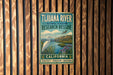 A vintage metal sign for the Tijuanan River National Estuarine Research Reserve in California, featuring a white heron and a scenic landscape.