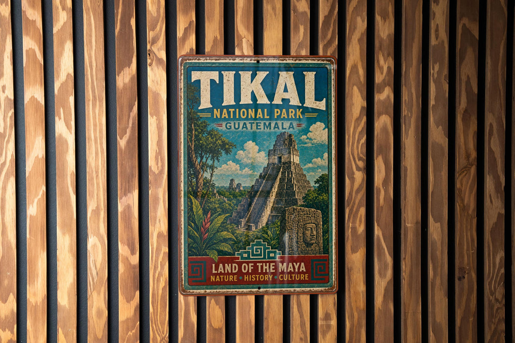 A vintage metal sign for Tikal National Park in Guatemala, featuring an illustration of the Mayan ruins of Tikal.