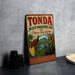 A vintage metal sign for the Tonda Wildlife Management Area in Papua New Guinea, featuring an illustration of various animals in a tropical setting.