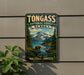 A vintage-style metal sign for Tongass National Forest in Alaska, featuring a scenic landscape with a bear, mountains, and a river.