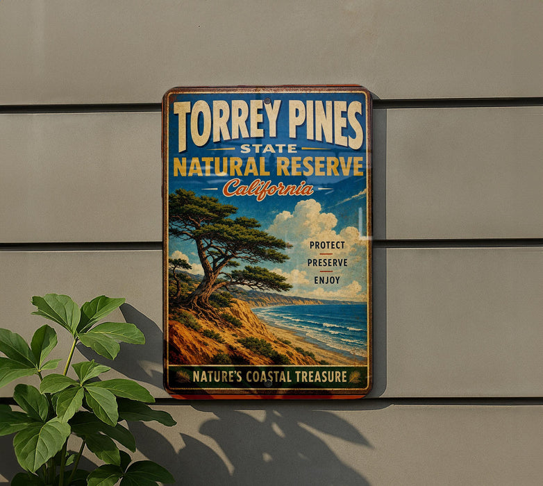 A vintage-style metal sign for Torrey Pines State Natural Reserve in California, featuring a scenic landscape with a pine tree and ocean.