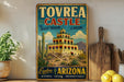 A vintage-style sign for Tovrea Castle, the Desert Treasure of Arizona, featuring a colorful illustration of the castle and desert landscape.