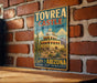 A vintage-style metal sign for the Tovrea Castle of Arizona, featuring a desert-themed illustration of the castle and cacti.