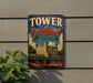 A vintage-style metal sign that reads "TOWER OF LONDON UNITED KINGDOM" with a castle illustration, mounted on a wall.