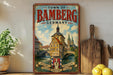 A vintage-style metal sign for the Town of Bamberg, Germany, featuring a painting of a historic building and a bridge.