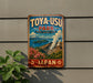 A vintage-style sign for Toya-USU Park, featuring a scenic landscape with mountains, flowers, and a volcano.