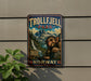 A vintage metal sign for Trollfjell Park in Norway, featuring a large illustration of a troll-like creature in a mountainous landscape.