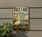 A vintage-style metal sign for Tule Lake National Wildlife Refuge in California, featuring a white duck and a scenic landscape.