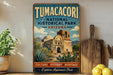 A vintage-style sign for Tumacori National Historical Park in Arizona, featuring an illustration of the historic Mission of San Ignacio and the surrounding desert landscape.