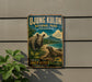 a vintage-style metal sign for the Javan Rhino National Park in Indonesia, with a rhino and a lizard depicted in a lush, tropical setting.