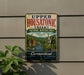 A vintage metal sign for Upper Housatonic Valley, New Hampshire's National Heritage Area, featuring a scenic image of a river and buildings.