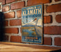 A vintage-style metal sign for Upper Klamath National Wildlife Refuge in Oregon, featuring an illustration of a bird and a mountain landscape.