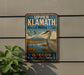A vintage-style metal sign for Upper Klath National Wildlife Refuge in Oregon, featuring a large bird and a scenic landscape.