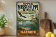 A vintage-style sign for Upper Mississippi River National Wildlife and Fish Refuge in Illinois, featuring illustrations of various wildlife species such as an eagle, a heron, and a fish.