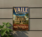 A vintage-style metal sign for the Vaile Mansion in Missouri, featuring an illustration of the mansion and the text "A Step Back in Time INDEPENDENCE MISSOURI".