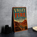 A vintage-style sign for Valley of Fire State Park, Nevada, featuring a desert landscape with mountains and a winding road.