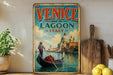 a vintage-style sign that reads "VENICE and its Lagoon ITALY", depicting a gondolier in a gondola on the water, with the iconic architecture of Venice in the background.