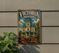 A vintage-style metal sign for Victoria Mansion in Maine, featuring an illustration of the mansion and the text "MAINE A MAINE'S PLEASURE".
