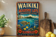 A vintage-style metal sign for the Waikiki Marine Life Conservation District in Hawaii, featuring a colorful illustration of a sea turtle swimming among tropical flowers and a tropical island backdrop.