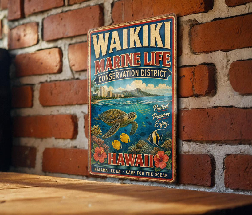 A vintage metal sign for the Waikiki Marine Life Conservation District in Hawaii, featuring a turtle, coral, and other marine life, mounted on a brick wall.