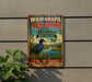 A vintage-style metal sign advertising Waiarapa Moana Wetland in New Zealand, featuring a bird and a scenic landscape.