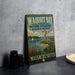A vintage-style metal sign for Waquoit Bay National Estuarine Research Reserve, featuring an illustration of a crane and a seagull, is displayed on a gray countertop next to some black camera lenses.