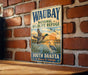 A vintage-style metal sign for the Waubay National Wildlife Refuge in South Dakota, featuring illustrations of ducks and other wildlife.