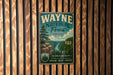 A vintage-style metal sign for Wayne National Forest in Ohio, featuring a scenic landscape with a river and mountains.