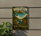 A vintage metal sign for Wharton State Forest in New Jersey, featuring a scenic illustration of a forest and a river.