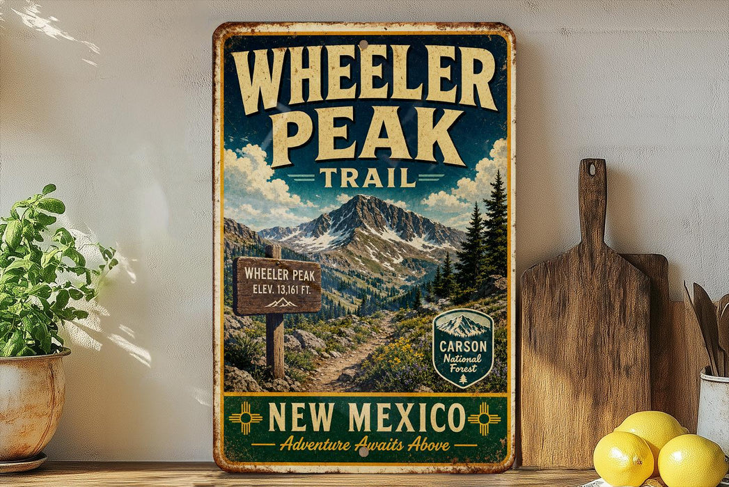 A vintage-style metal sign for Wheeler Peak Trail in New Mexico, featuring a mountain landscape and trail information.
