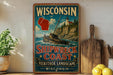 A vintage-style sign for Wisconsin's Shipwreck Coast, featuring a lighthouse and a ship on a rocky coastline.