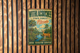 A vintage metal sign with the text "WITHLACOCHEE STATE FOREST Florida" and an illustration of a deer in a forest setting.