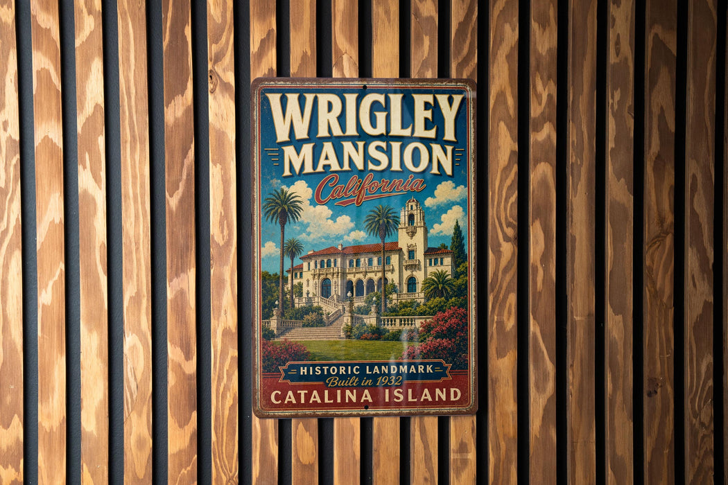 A vintage metal sign for Wrigley mansion in Catalina Island, California, featuring a colorful illustration of the mansion and palm trees.