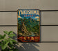 A vintage metal sign with the text "Yakushima Japan" and a scenic image of a mountainous landscape with a river, hanging on a wall.