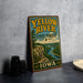 A vintage-style sign for the Yellow River State Forest in Iowa, featuring a scenic illustration of a river and mountains.