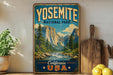 A vintage-style poster of Yosemite National Park, featuring a scenic mountain landscape with a river and pine trees, is displayed on a wall next to a wooden cutting board and some lemons.
