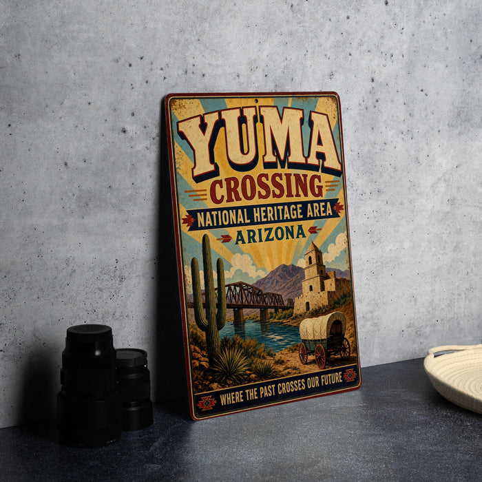 A vintage-style sign for Yuma Crossing, a National Heritage Area in Arizona, featuring a desert landscape with a bridge and a wagon.