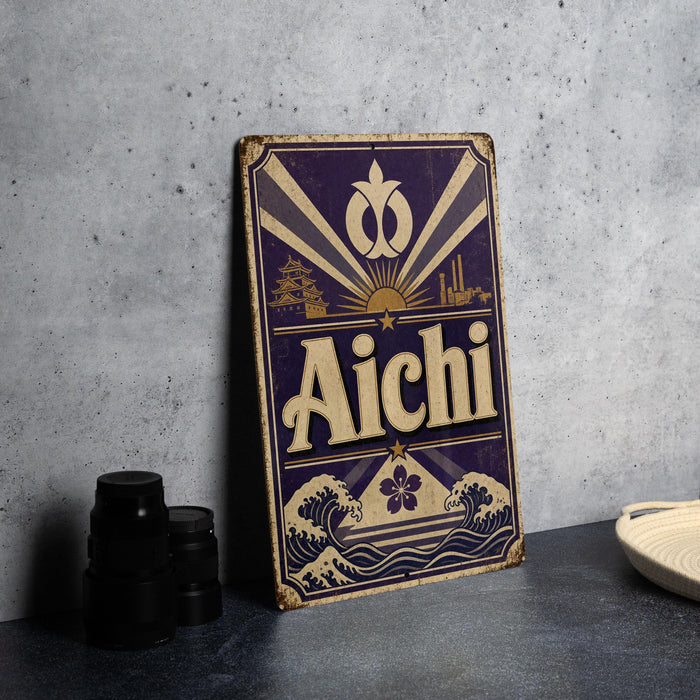 A vintage-style sign for Aichi, featuring a sunburst design and the word "Aichi" prominently displayed.