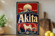 A vintage-style sign for Akita beer featuring a dog silhouette, mountains, and a sun in the background.