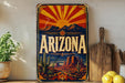 A vintage-style sign depicting the state of Arizona with a desert landscape and sun in the background.