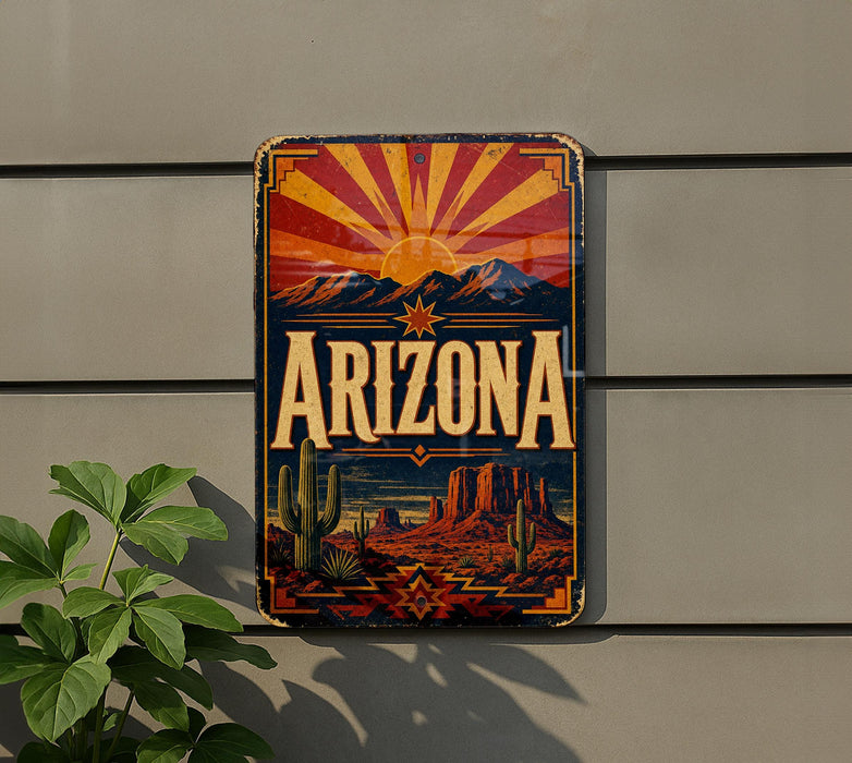 A vintage-style sign with the word "ARIZONA" prominently displayed, featuring a desert landscape with mountains, cacti, and a sunburst design.