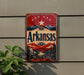A vintage-style sign for Arkansas, featuring a red background with a star and mountains, and the text "Arkansas" prominently displayed.