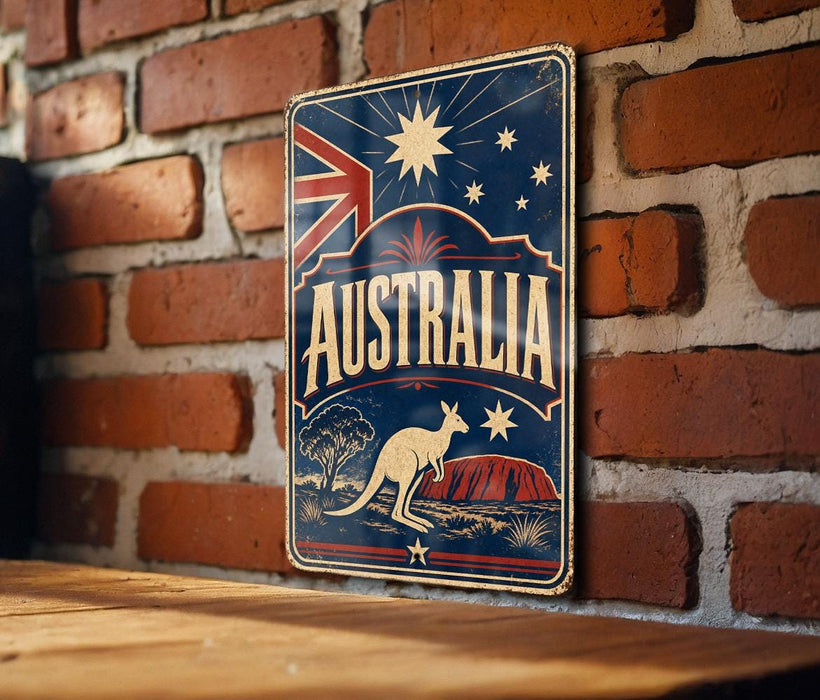 A vintage-style metal sign with the word "AUSTRALIA" prominently displayed, featuring a kangaroo and a red rock formation, all set against a backdrop of stars and a red, white, and blue color scheme.