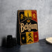 A vintage metal sign with the word "Belgium" prominently displayed, featuring a coat of arms and a castle in the background.