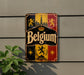 A vintage-style metal sign with the word "Belgium" prominently displayed, featuring a coat of arms and a castle-like structure.