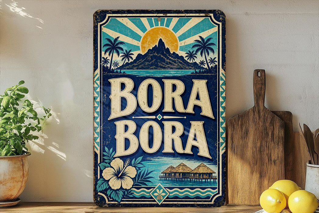 A vintage-style metal sign with the text "BORA BORA" displayed prominently, featuring a tropical landscape with palm trees, a mountain, and a sun. The sign is placed on a shelf next to a wooden cutting board and a potted plant.