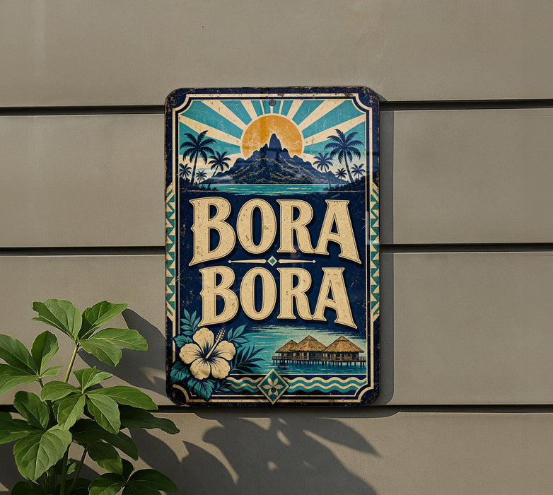 A vintage-style metal sign with the text "BORA BORA" displayed prominently, featuring a tropical island landscape with palm trees, a sun, and a hibiscus flower.