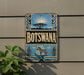 a vintage Botswana sign mounted on a wall, with a zebra and sun motif.