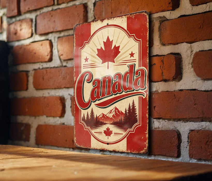 A vintage-style metal sign with the word "Canada" prominently displayed, featuring a maple leaf and mountains in the background.