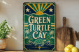 A vintage-style sign for "Green Turtle Cay" is displayed on a shelf, accompanied by a wooden cutting board and a potted plant.